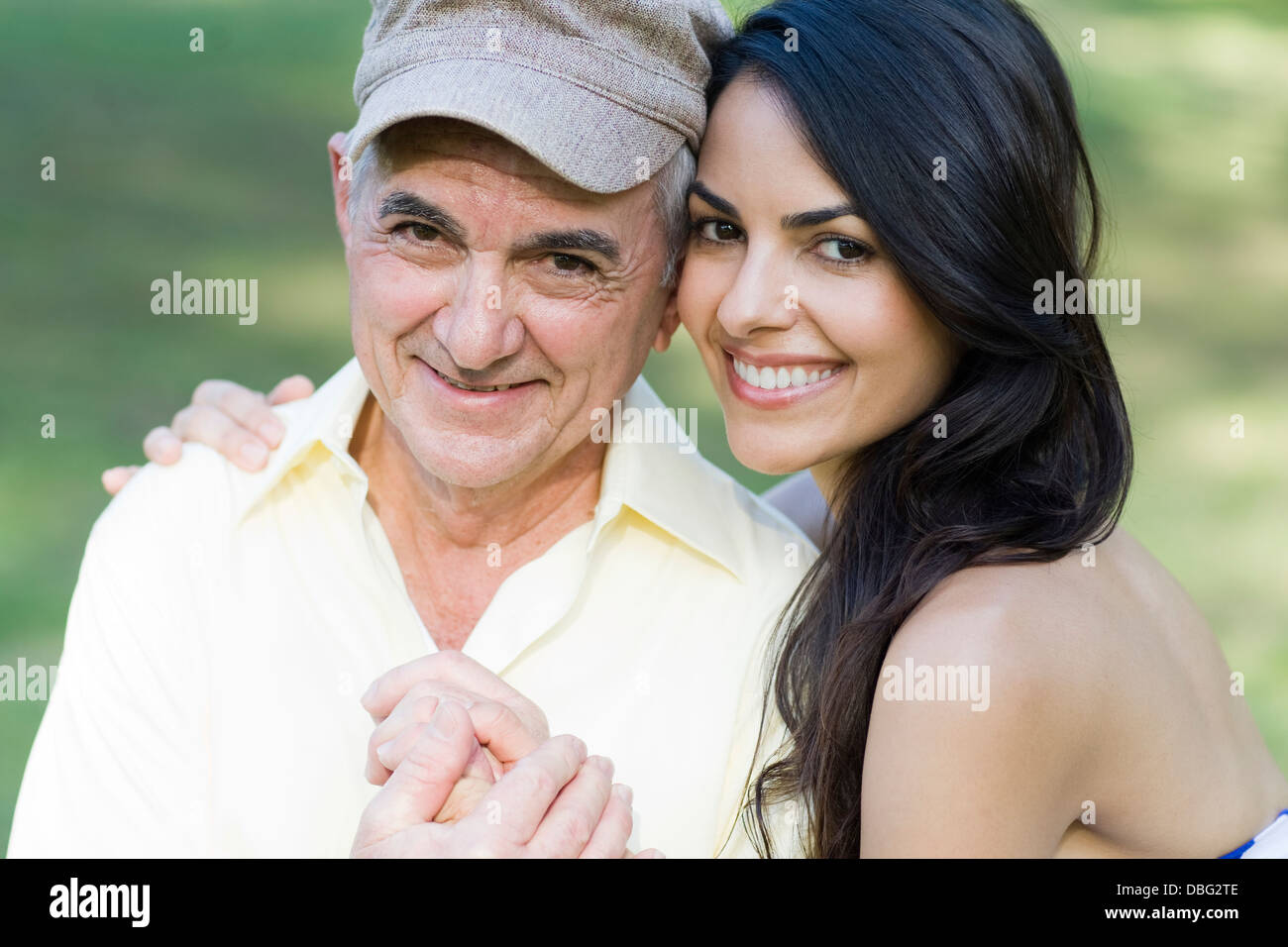 Hispanic father and daughter smiling outdoors Stock Photo