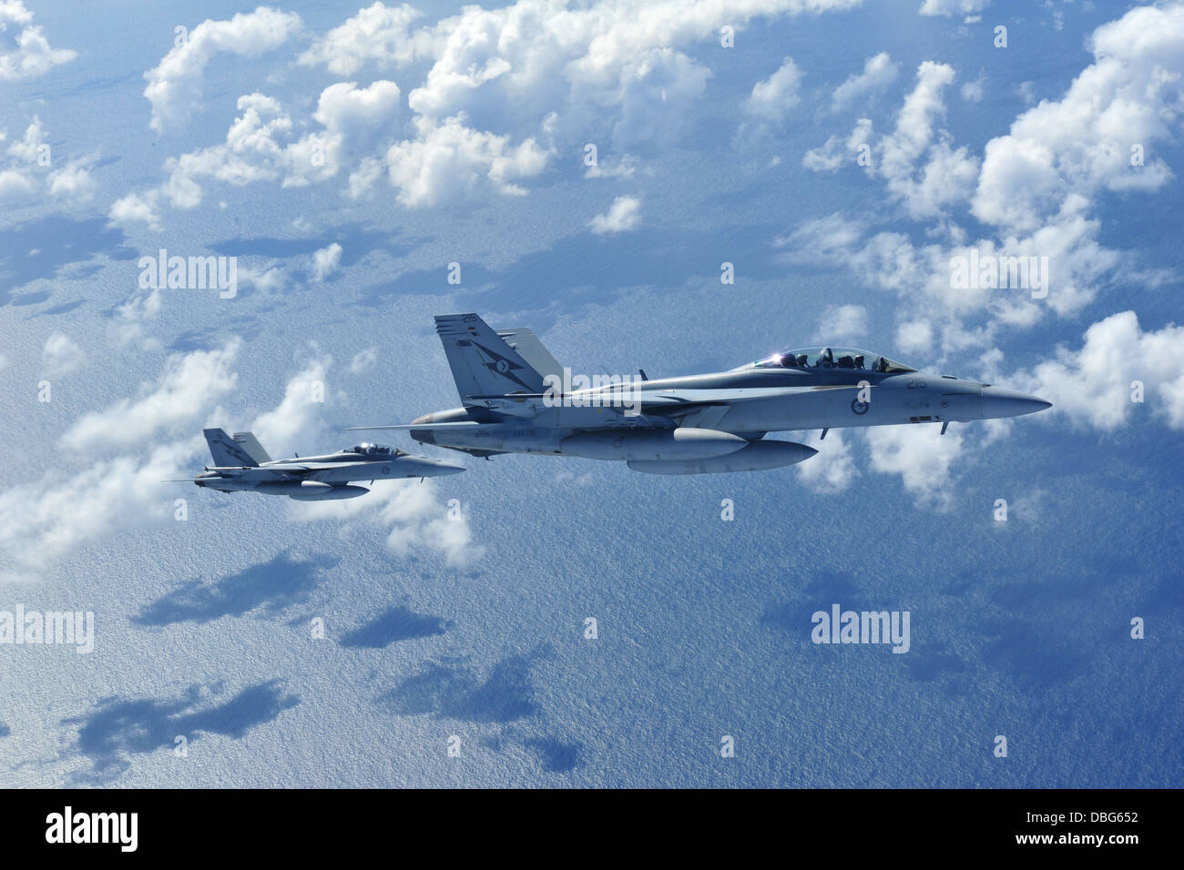 Two Royal Australian Air Force F-18 Super Hornets prepare to refuel off the coast of Queensland, Australia, July 26, 2013. The refueling mission was part of Talisman Saber 2013, an exercise that provides realistic, relevant training necessary to maintain Stock Photo