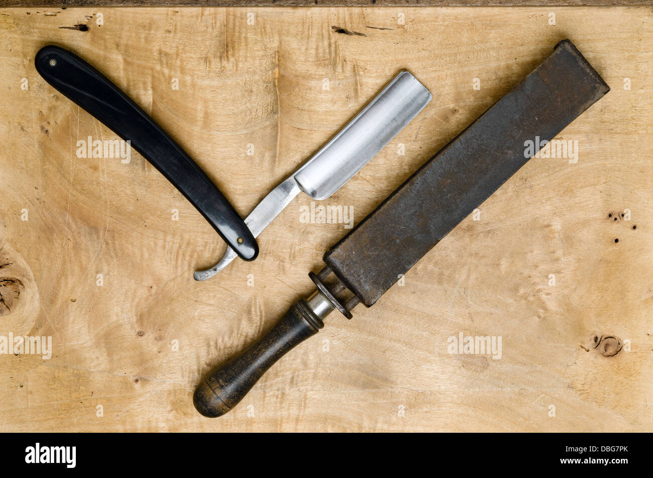 Straight Razor and shaving supplies on a wooden background Stock Photo