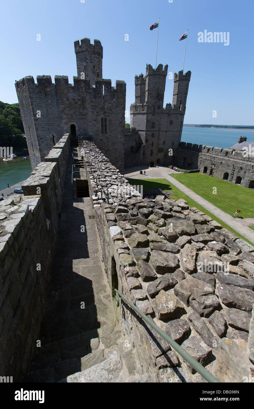 Town of Caernarfon, Wales. Caernarfon Castle, with the Eagle Tower on the right and the Queen’s
