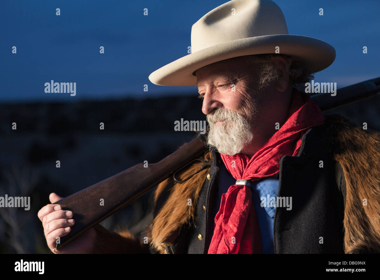 Caucasian man holding gun outdoors Stock Photo