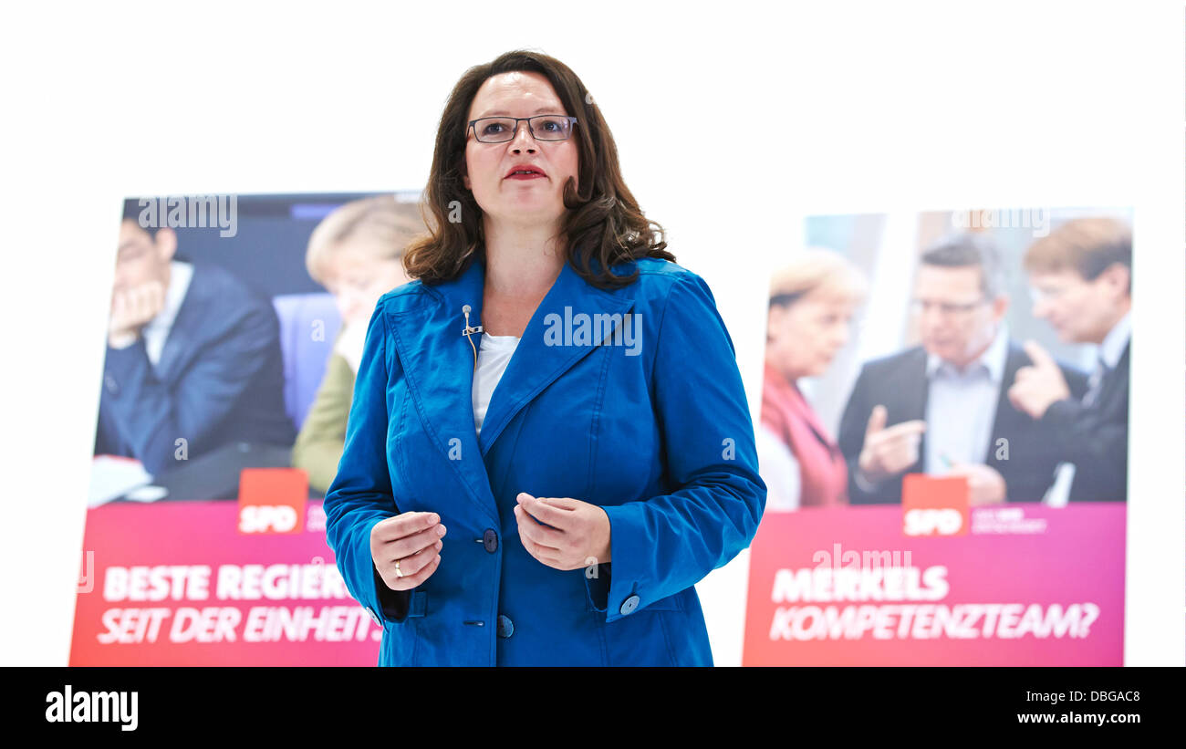 Berlin, Germany. 30 July, 2013. SPD Chancellor candidate Peer Steinbrück and SPD General Secretary Andrea Nahles have introduced the important parts of the SPD election campaign for the parliamentary elections in 2013 in Berlin. / Picture: Andrea Nahles (SPD), SPD FDP General Secretary, show the new placcard of the SPD for the campaign for German Federal Parliament election 2013 in Berlin. Credit:  Reynaldo Chaib Paganelli/Alamy Live News Stock Photo