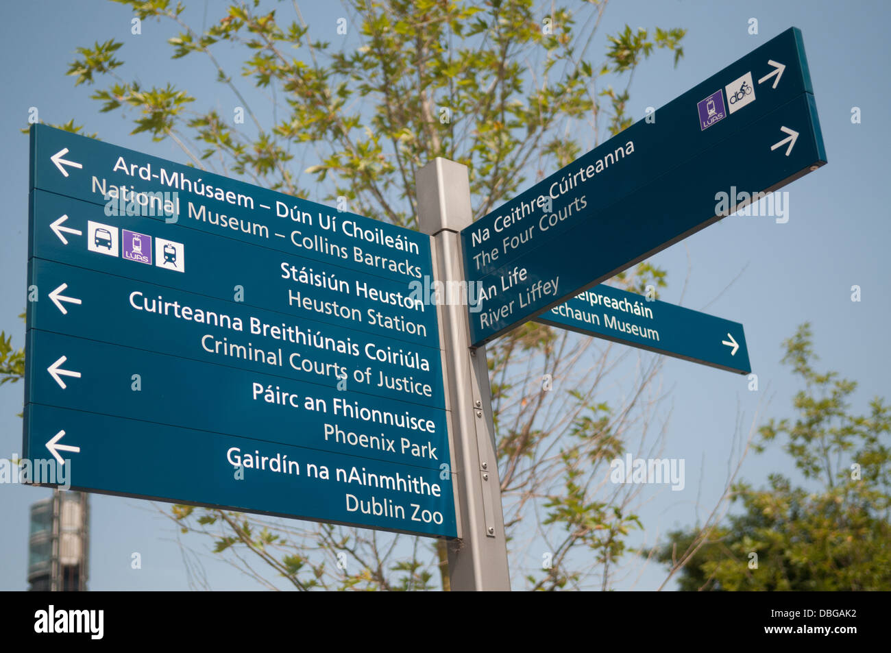 Road sign indicating directions in two languages - in Gaelic and English, Dublin, Republic of Ireland. Stock Photo