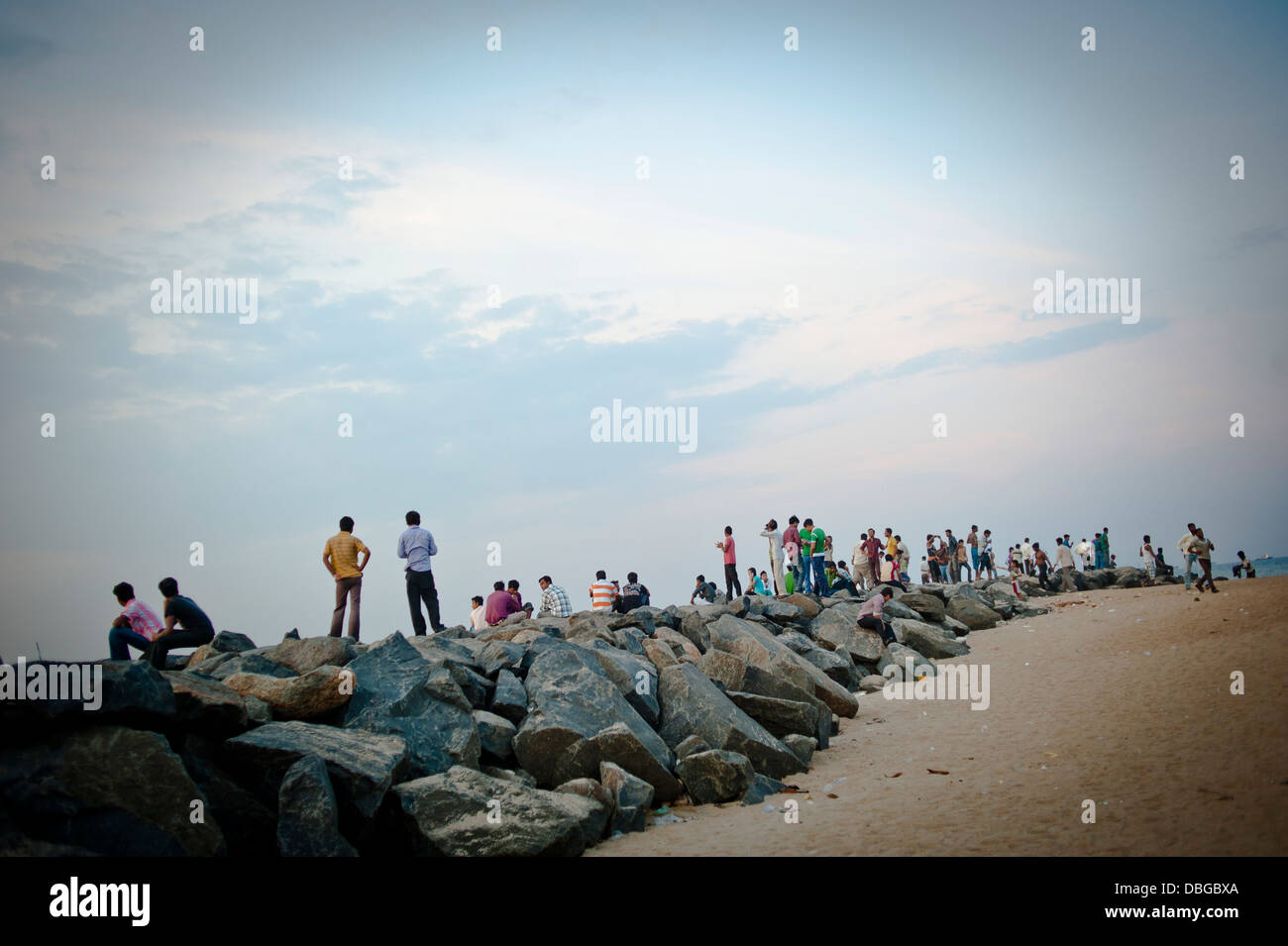 Local Indian men gathered at the seafront on Marina beach in the Southern Indian city of Chennai Stock Photo
