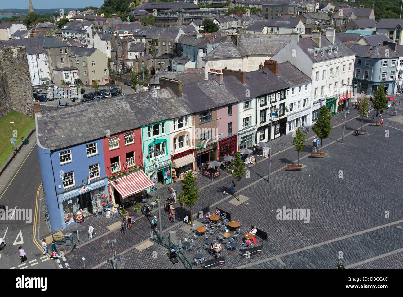 Town of Caernarfon, Wales. Picturesque colourful view of shops and cafes in Caernarfon’s Castle Square. Stock Photo
