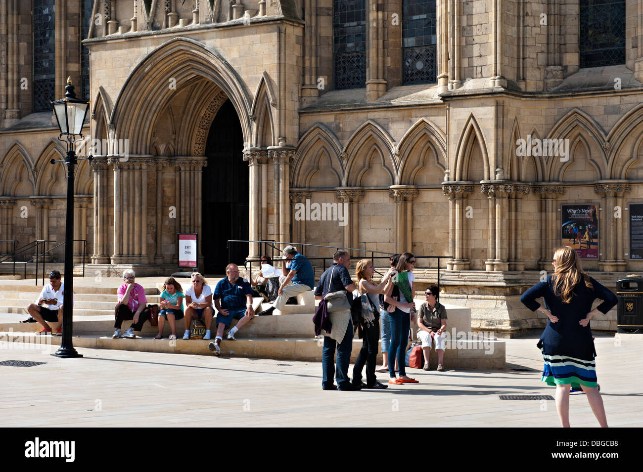 Tourists and sightseers outside York Minster Cathedral, UK Stock Photo