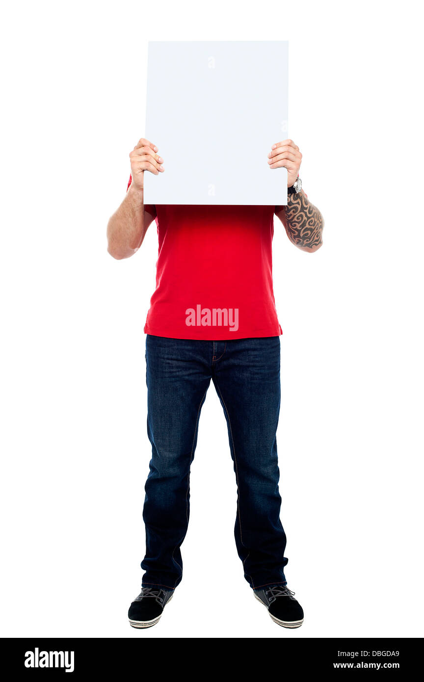 Man hiding his face behind blank white ad board Stock Photo - Alamy