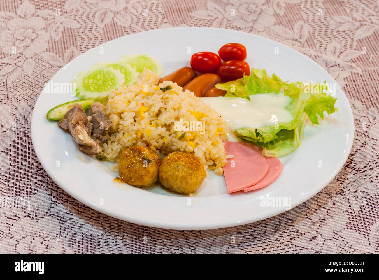 Plate of Delicious Fried Rice on a Lace Tablecloth Stock Photo