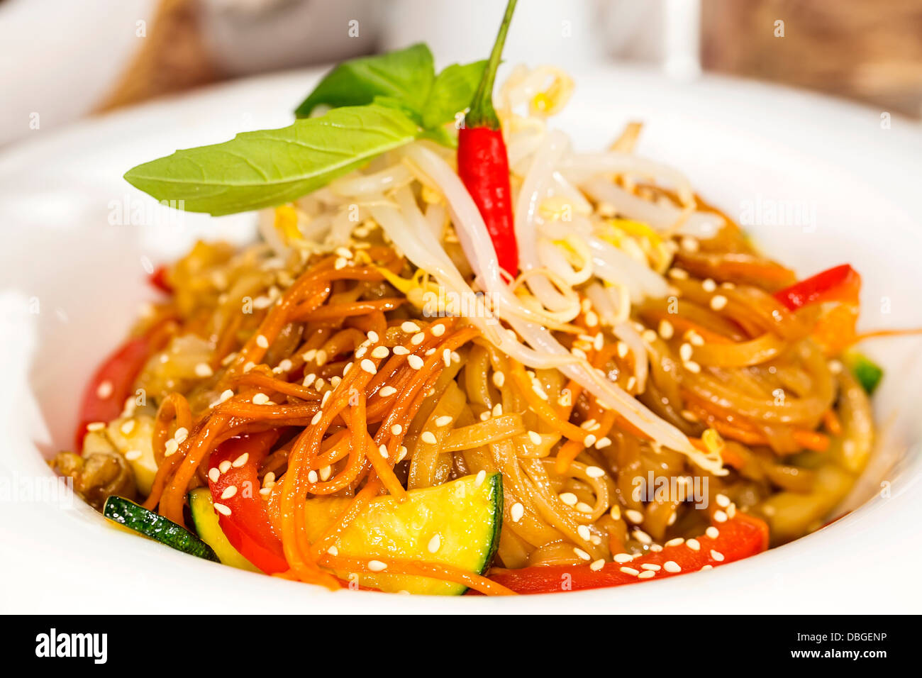 Spaghetti With Rice Model Rice spaghetti with vegetables on a white plate in a restaurant Stock ...