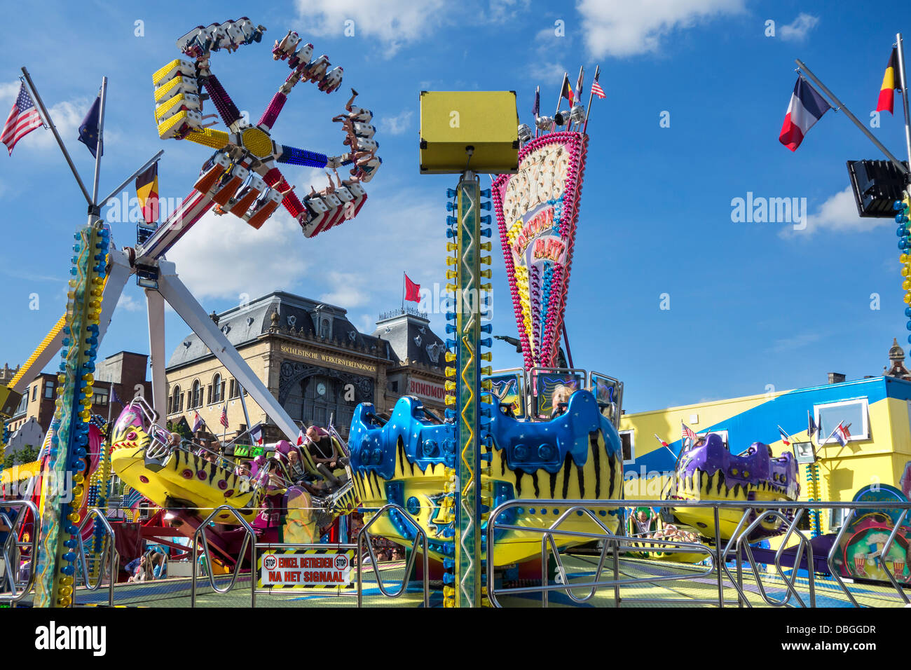 Fairground attractions at travelling funfair / traveling fun fair at the Gentse Feesten / Ghent Festivities in summer, Belgium Stock Photo