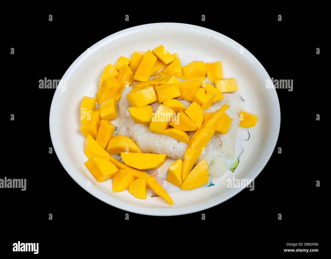 sticky rice in coconut cream with ripe mango, Isolated. Stock Photo