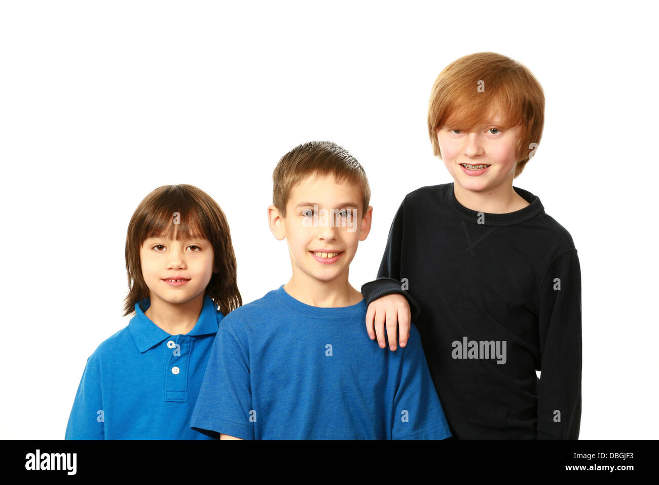 diverse group of boys smiling on white background Stock Photo - Alamy