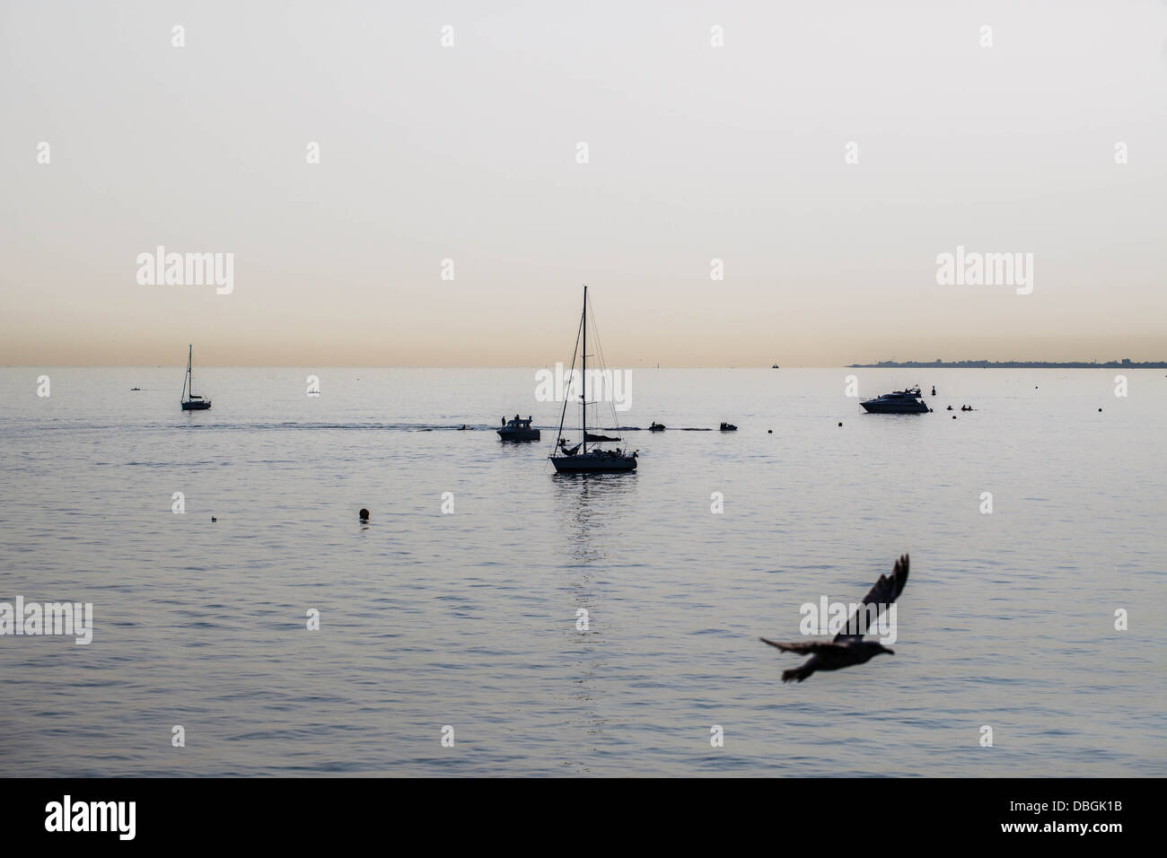 Silhouettes of boats at twilight, Brighton, Sussex, England, UK. Stock Photo