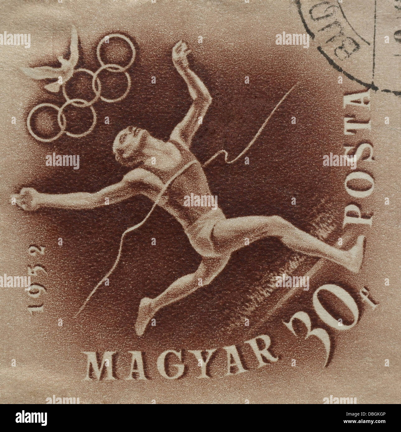 Brown 30 filler Magyar Posta stamp, with athlete breaking tape, publicising 1952 Olympic Games, issued Budapest, May, 1952 Stock Photo