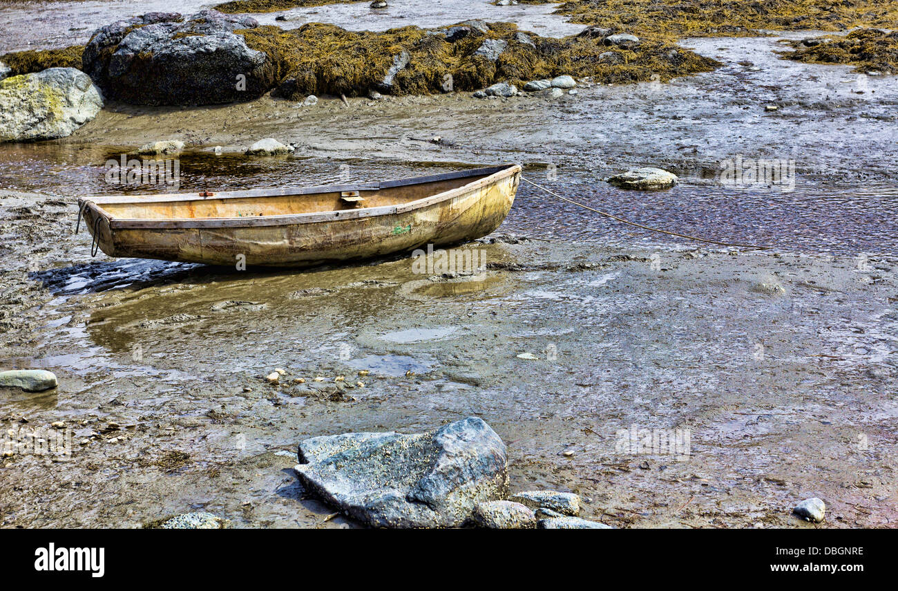 A very old abandoned boat on shore. Stock Photo