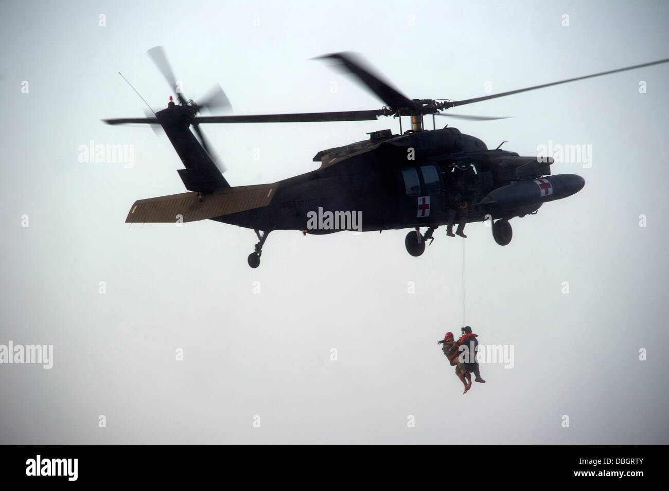 A US Army Flight Medic retrieves a Green Beret special forces soldier ...