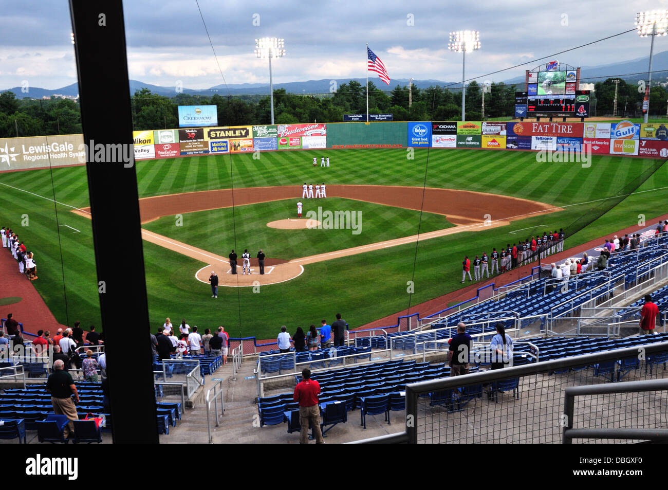 Players and spectators stand for the national anthem at Lewis Gale