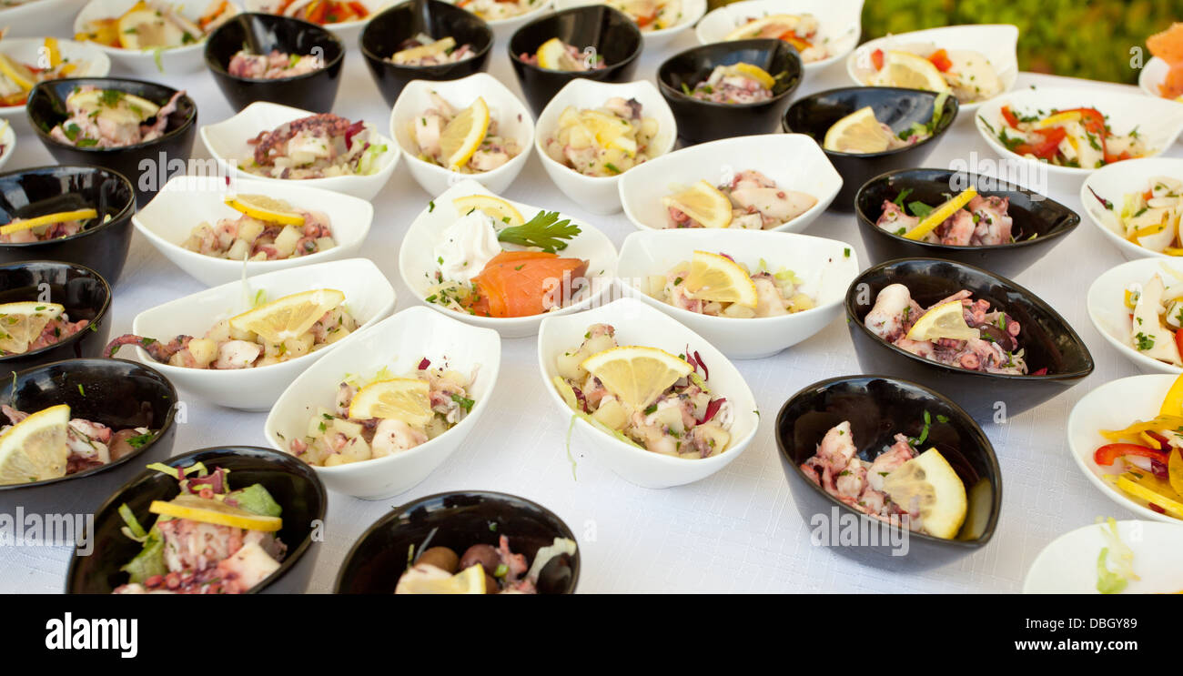Buffet bowls with a variety of fish and shellfish finger food Stock Photo