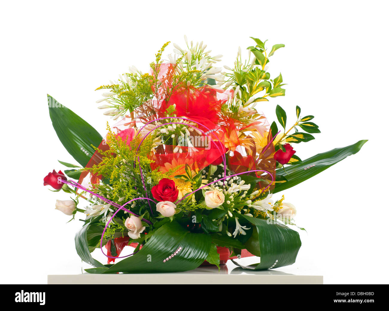 Basket of various flowers on white background Stock Photo