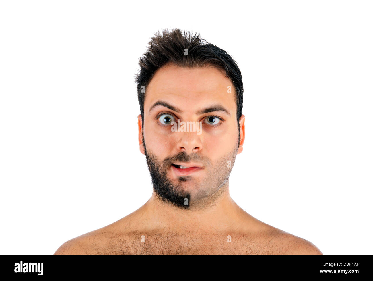 A young man with a beard on half of the face on white background Stock Photo