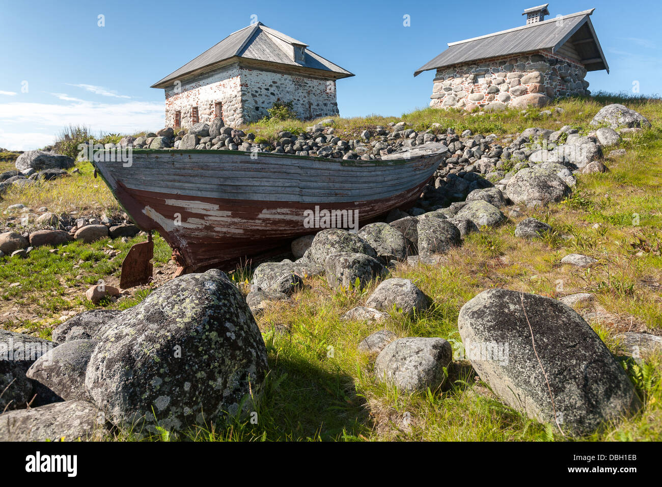 Old boat and stone houses. Stock Photo
