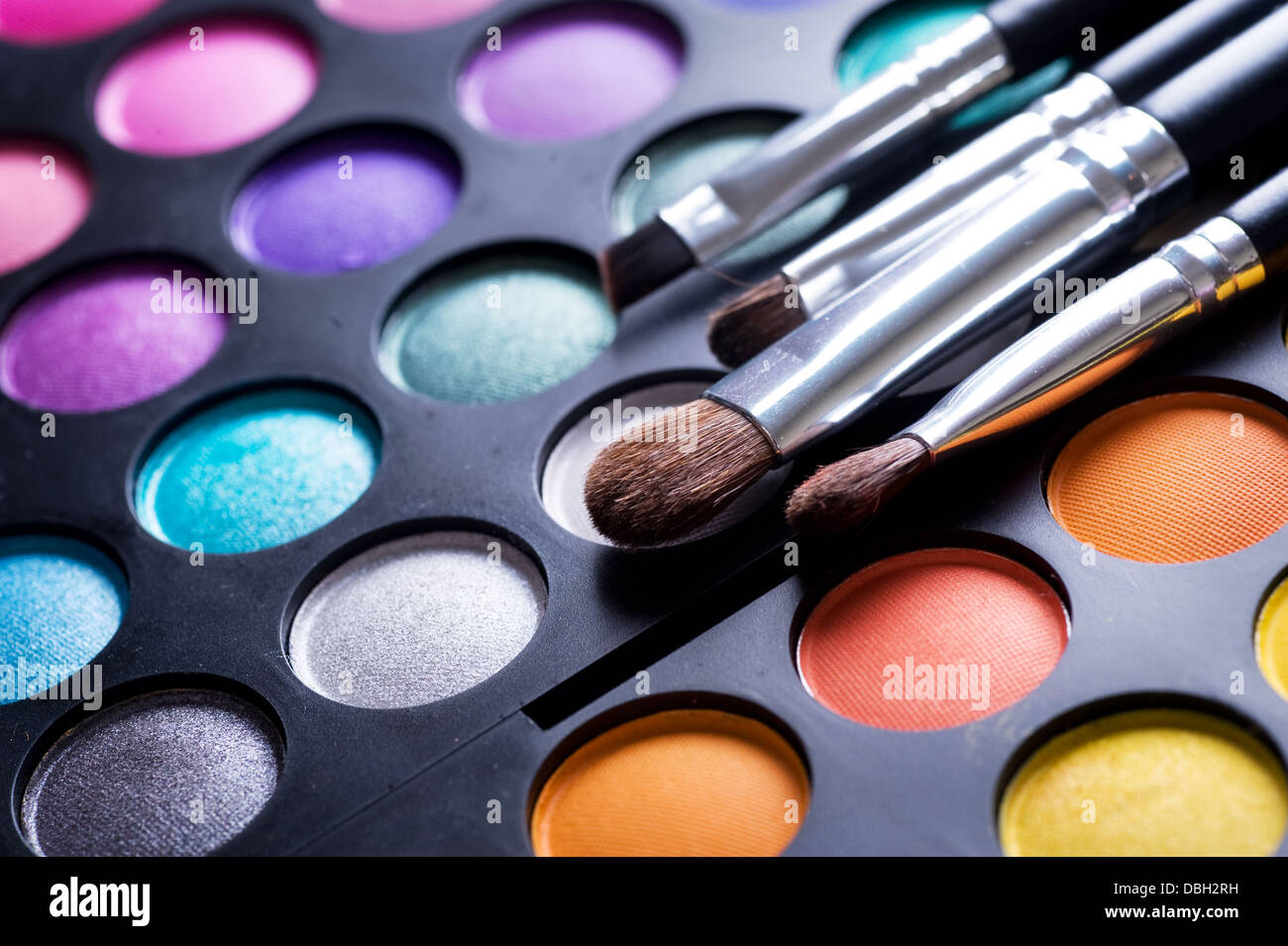 Makeup brushes and make-up eye shadows Stock Photo