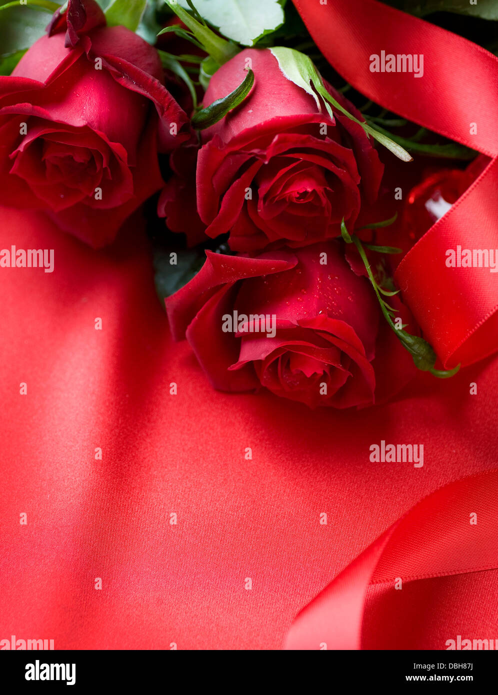 Red Roses bouquet over silk background Stock Photo - Alamy
