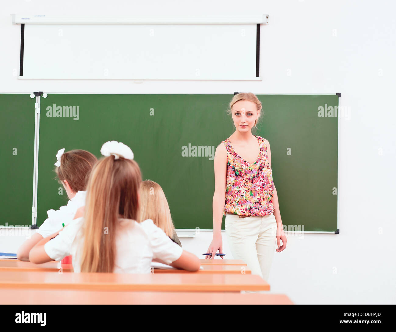 teacher and pupils in classroom Stock Photo - Alamy
