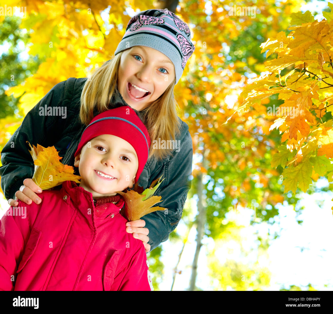 Happy Kids in Autumn Park Stock Photo - Alamy