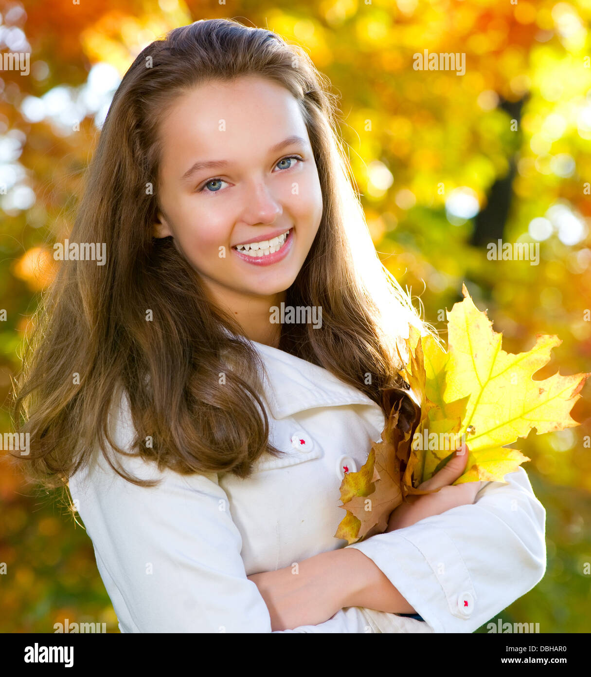 Beautiful Teenage Girl in autumn park Stock Photo - Alamy