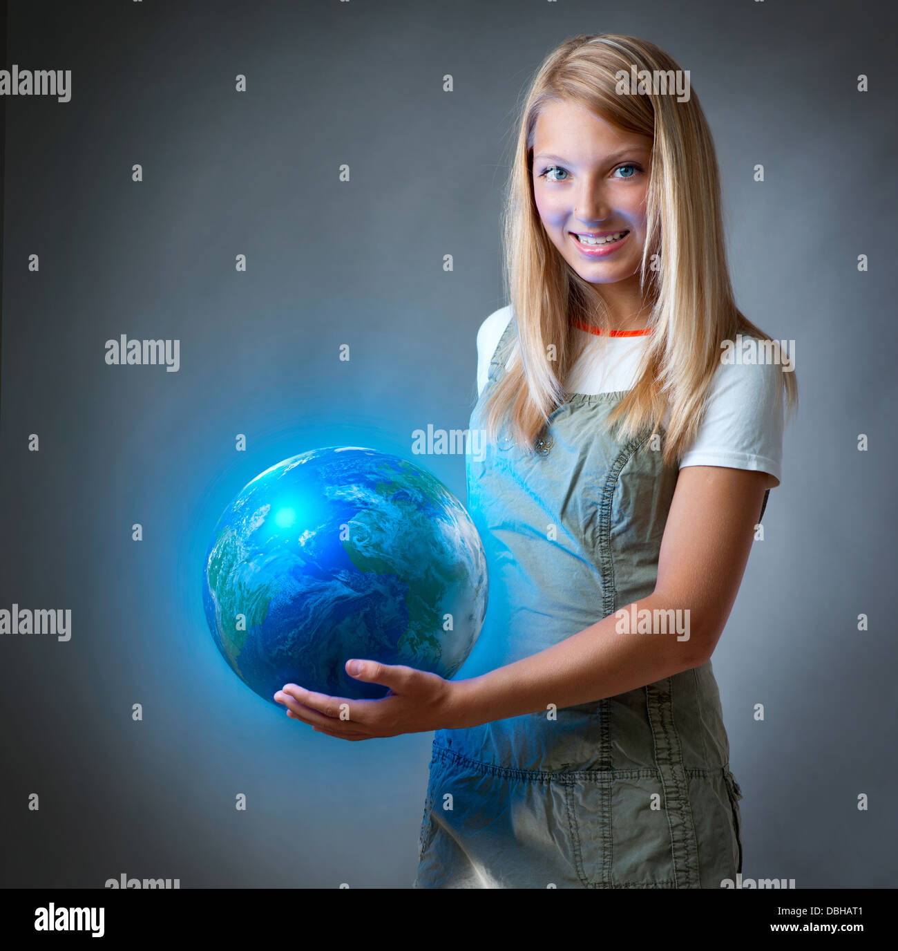 Girl holding the Planet Earth. Future Concept Stock Photo