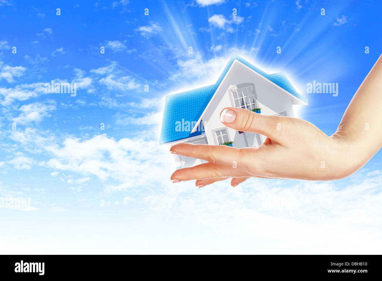 the house in hands on blue sky Stock Photo - Alamy
