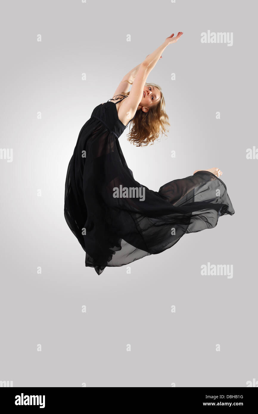 Young female dancer jumping Stock Photo Alamy