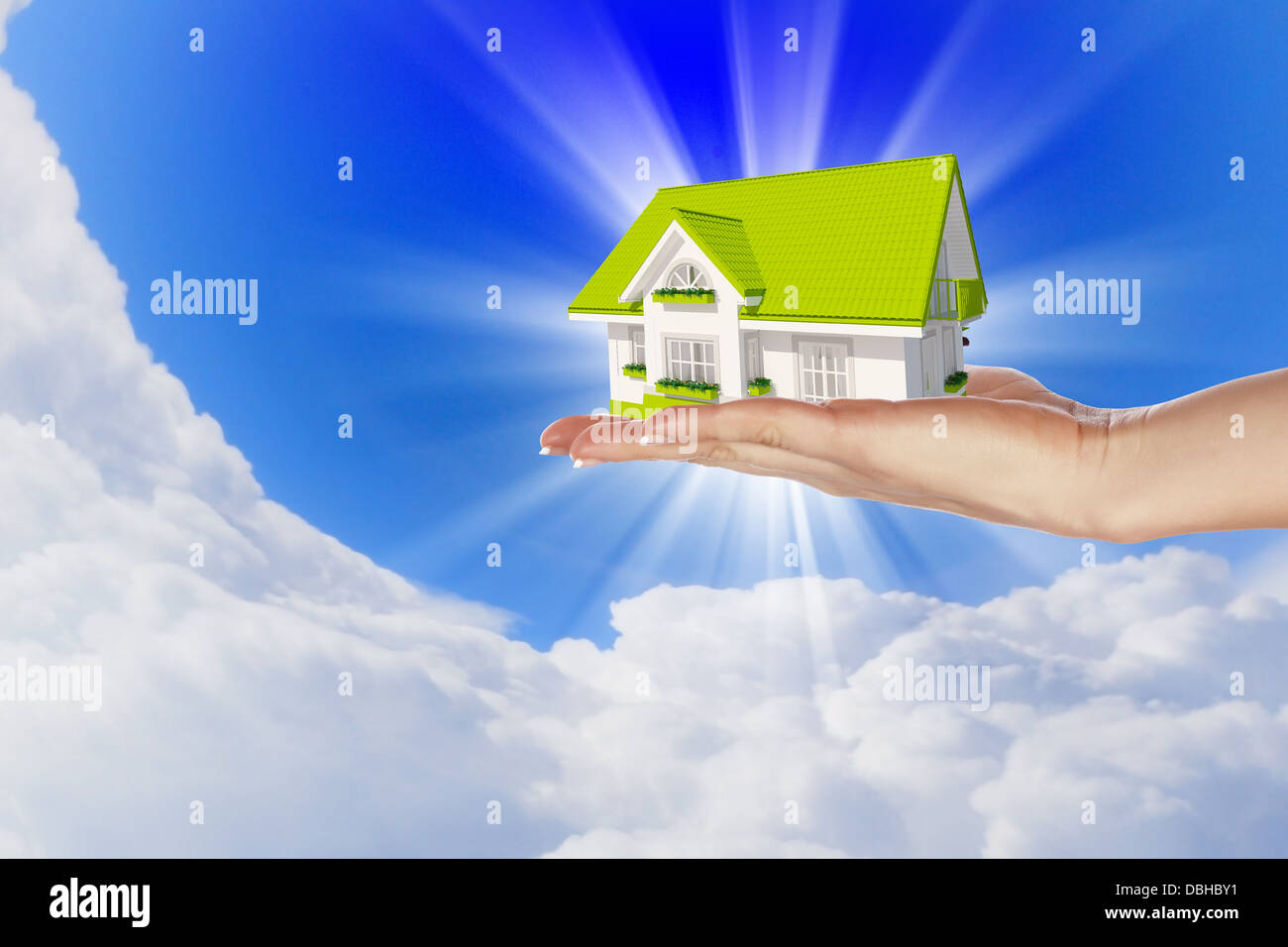 the house in hands on blue sky Stock Photo - Alamy