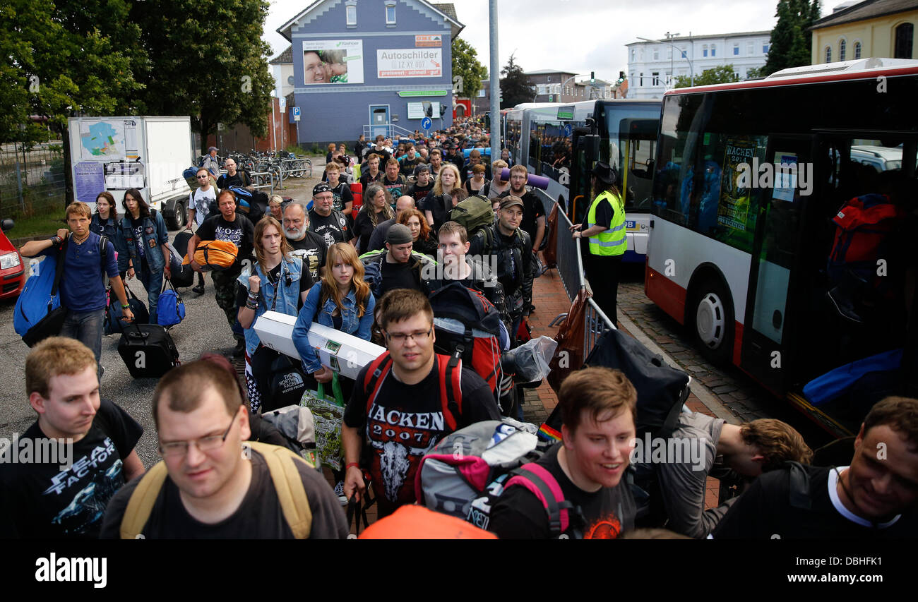 Fans of festival Wacken Open Air (WOA) leave the train station in Itzehoe,  Germany, 31 July 2013. Around 900 visitors from the south of Germany  travelled to the world's biggest heavy metal