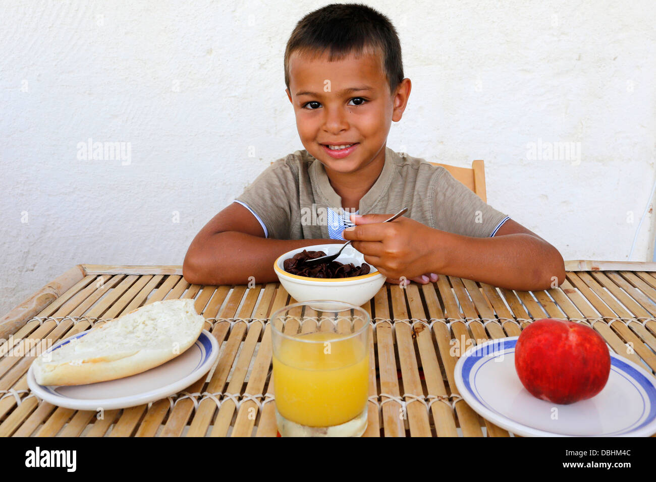 6yearold boy eating breakfast Stock Photo Alamy