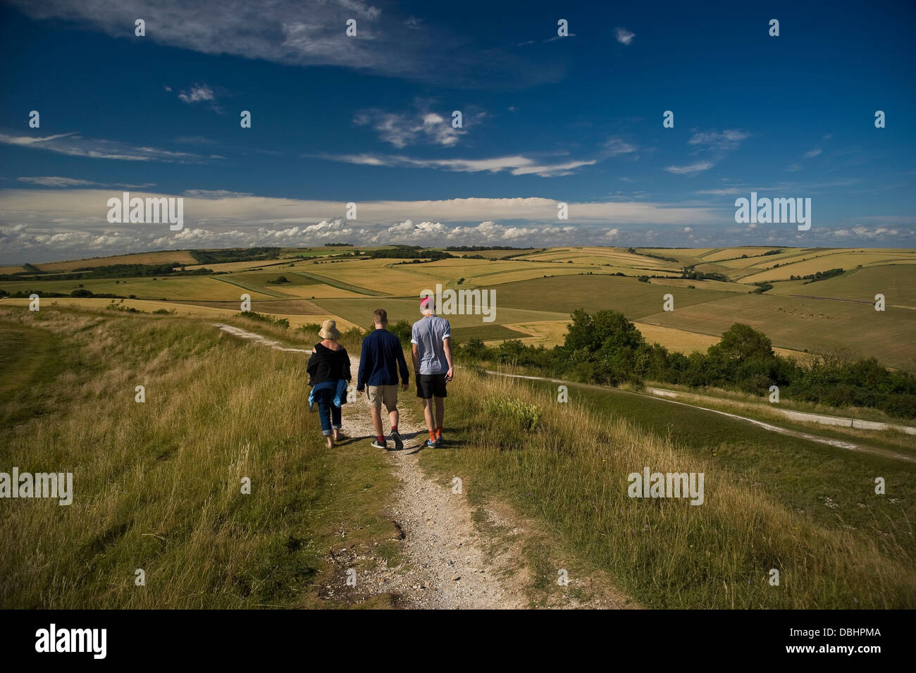 Family walking on Cissbury Rings near Worthing, West Sussex, UK Stock Photo
