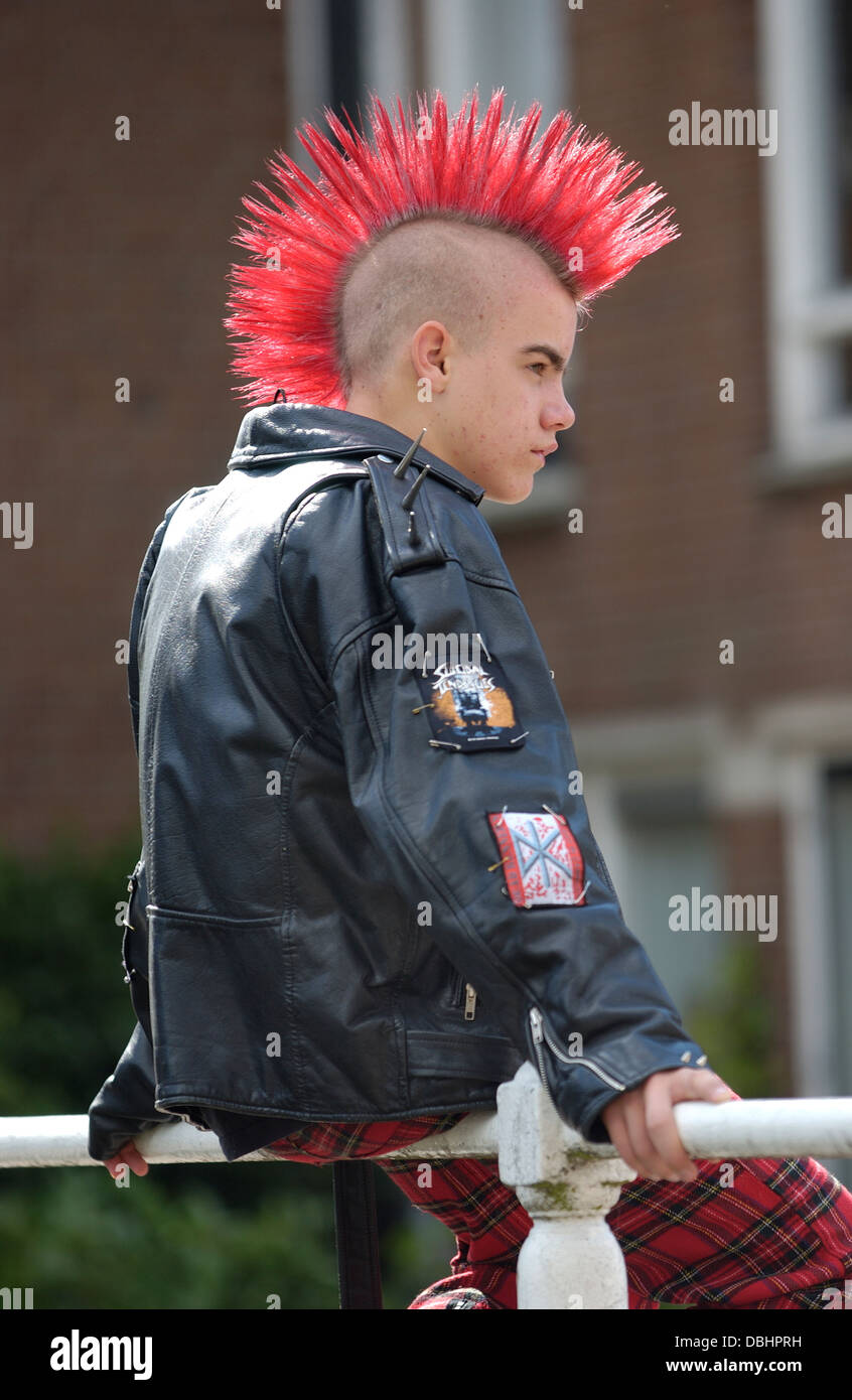 Punk boy with a red mohawk hairstyle Stock Photo