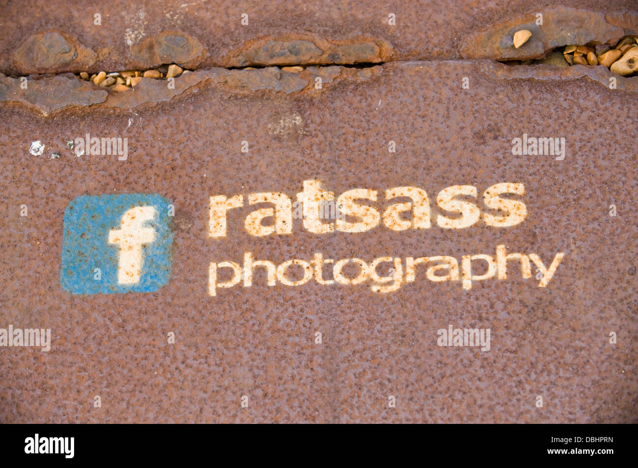 Facebook graffiti for ratsass photography on seafront in Brighton East Sussex England UK Stock Photo