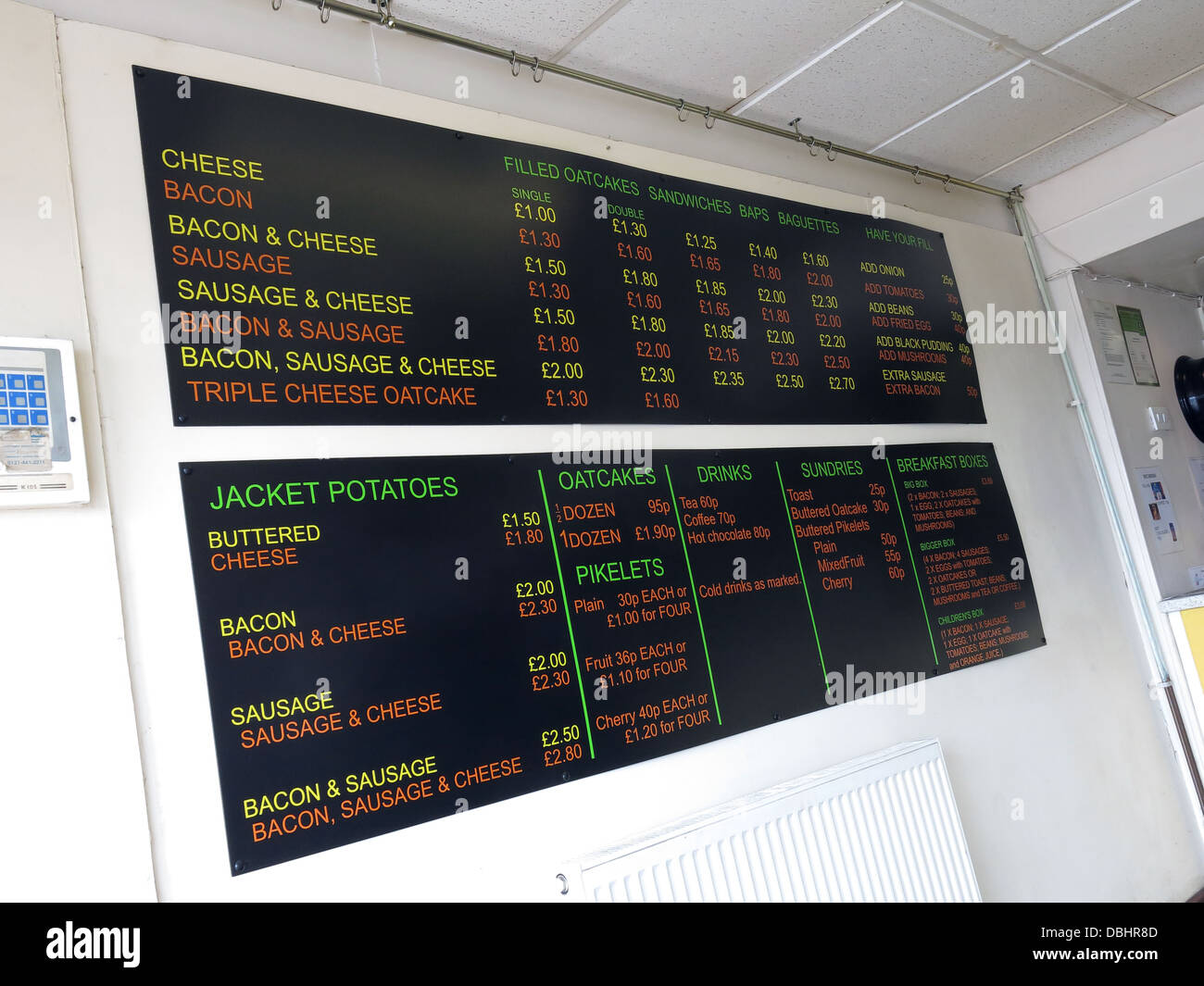 Interior menu of a traditional Stoke / Staffordshire Oatcake shop, with bright yellow frontage. Stock Photo