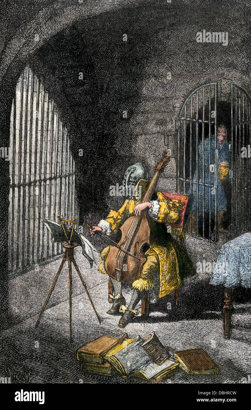 Scene from Alexandre Dumas' story, The Man in the Iron Mask. Hand-colored halftone reproduction of an illustration Stock Photo