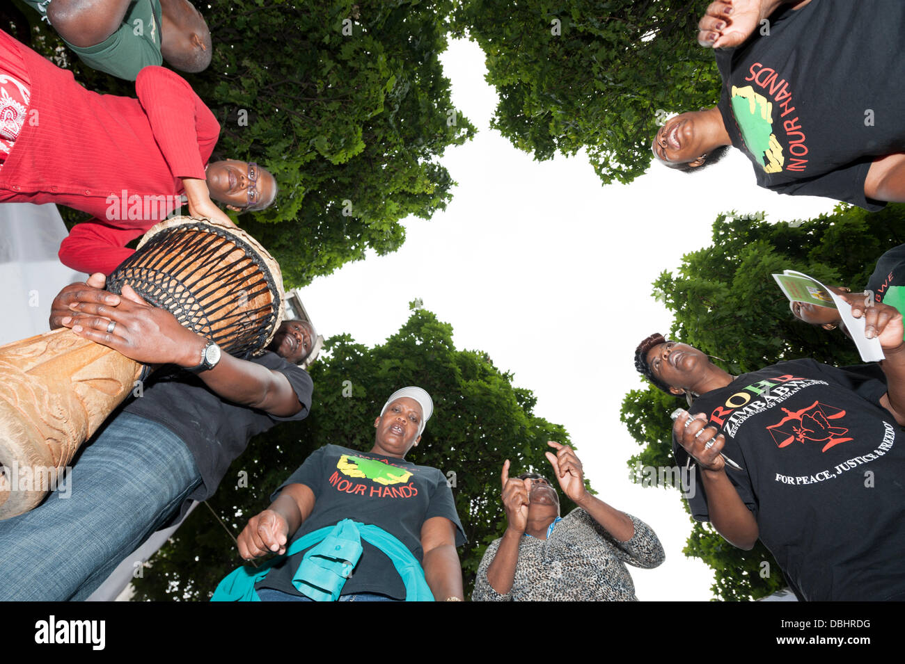 London, UK. 31st July, 2013. Demonstrators hold a song and dance vigil in London. Today Zimbabwe goes to the polls in a general election which many believe will be rigged by the current president, Robert Mugabe. Credit:  Lee Thomas/Alamy Live News Stock Photo