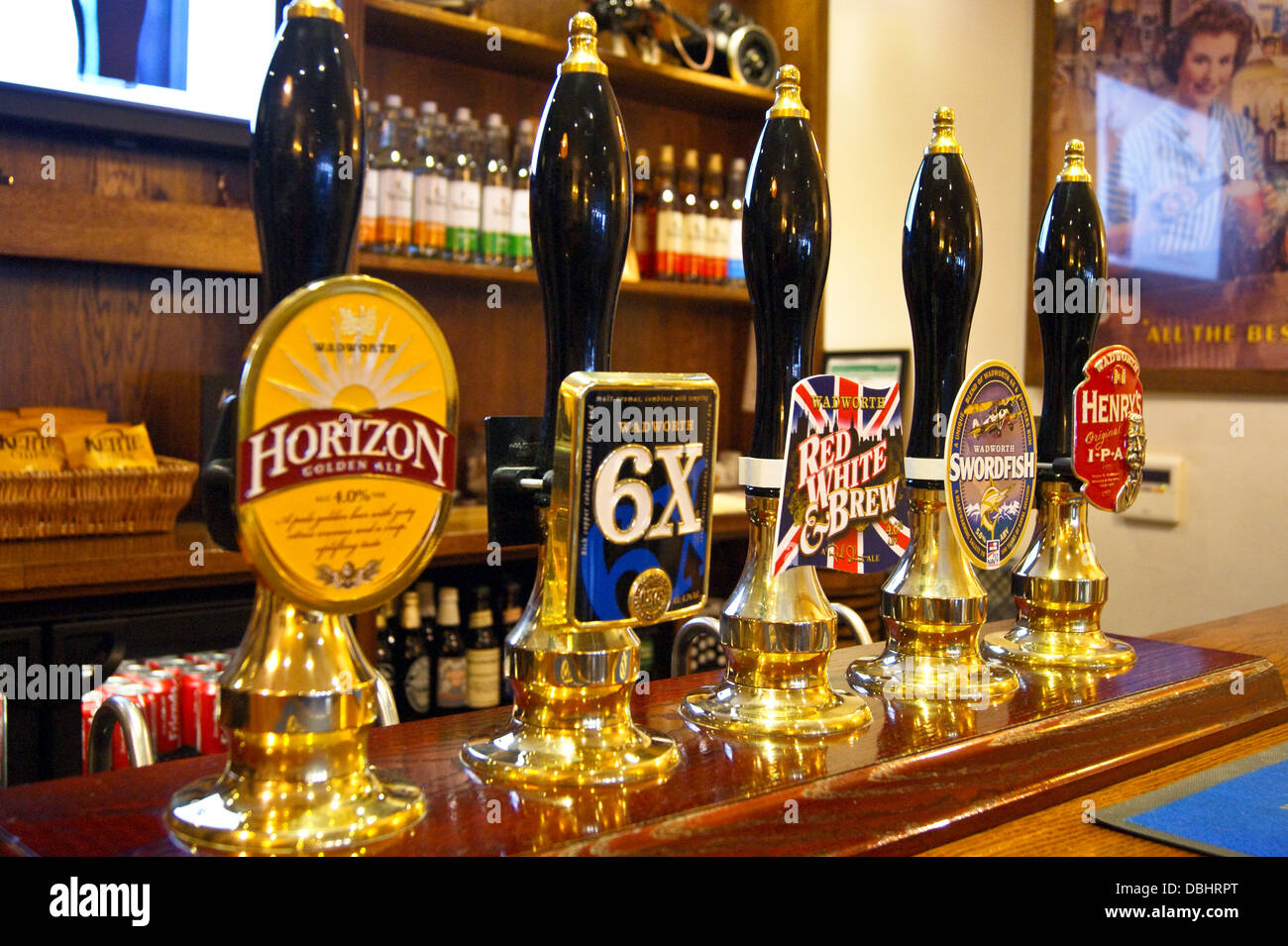 Wadworth of Devizes real ale handpumps and pump clips on a pub bar Stock Photo