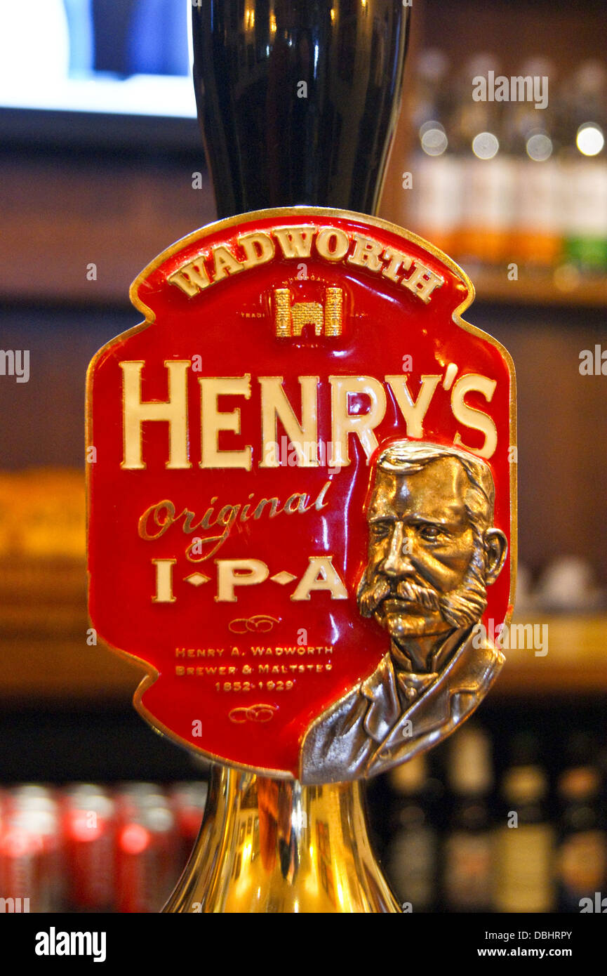 Wadworth of Devizes Henry's IPA real ale handpumps and pump clips on a pub bar Stock Photo