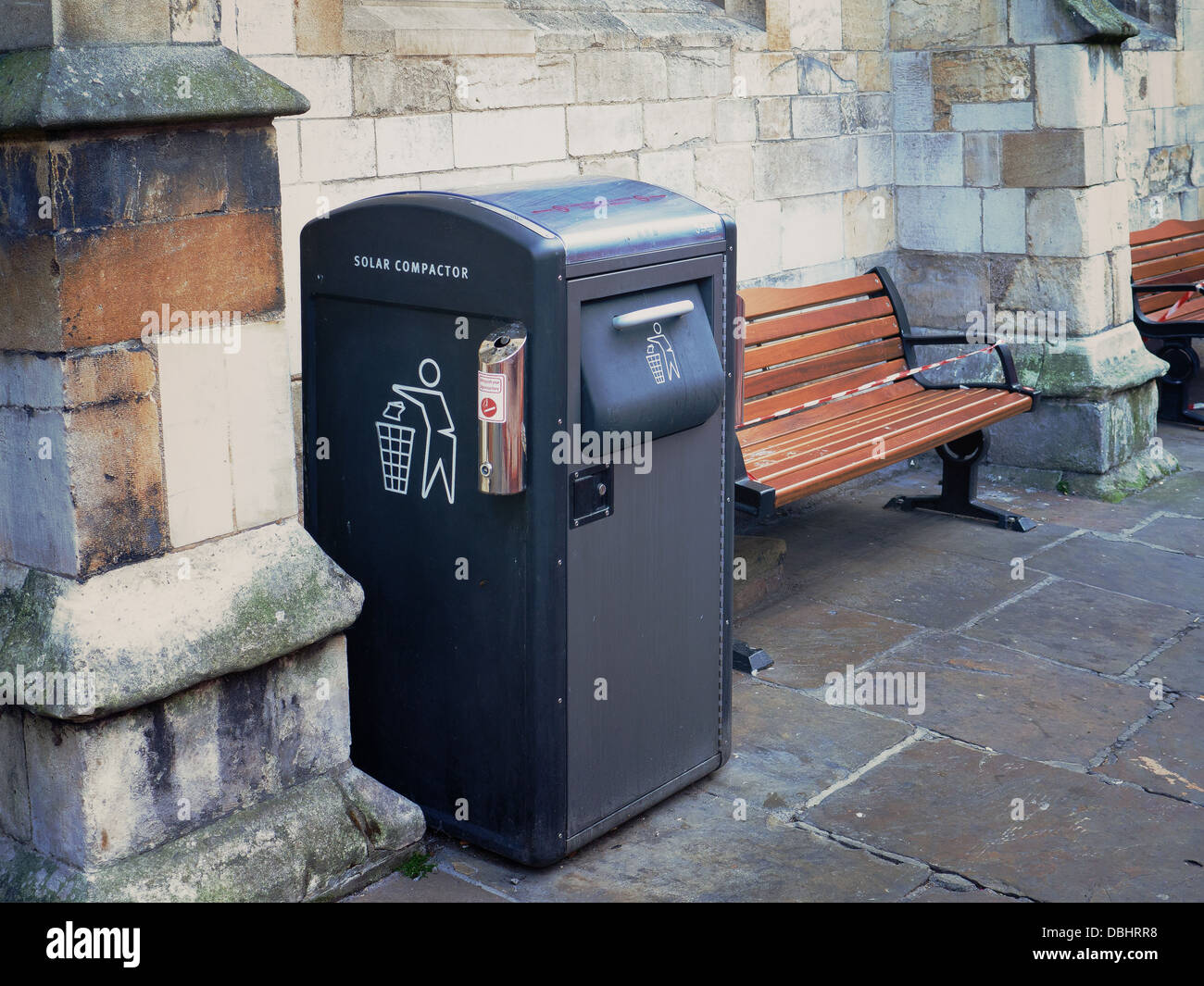 A 'Solar Compactor' litter bin uses solar energy to compact down waste, increasing its capacity compared to standard bins. Stock Photo