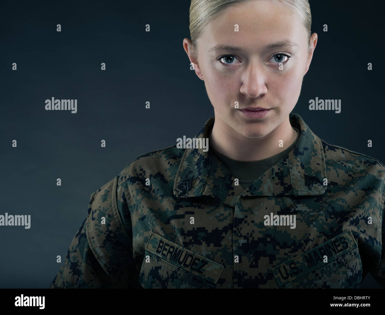 Portrait of Female United States Marine Corps Soldier in utility uniform MARPAT pixelated camouflage Stock Photo