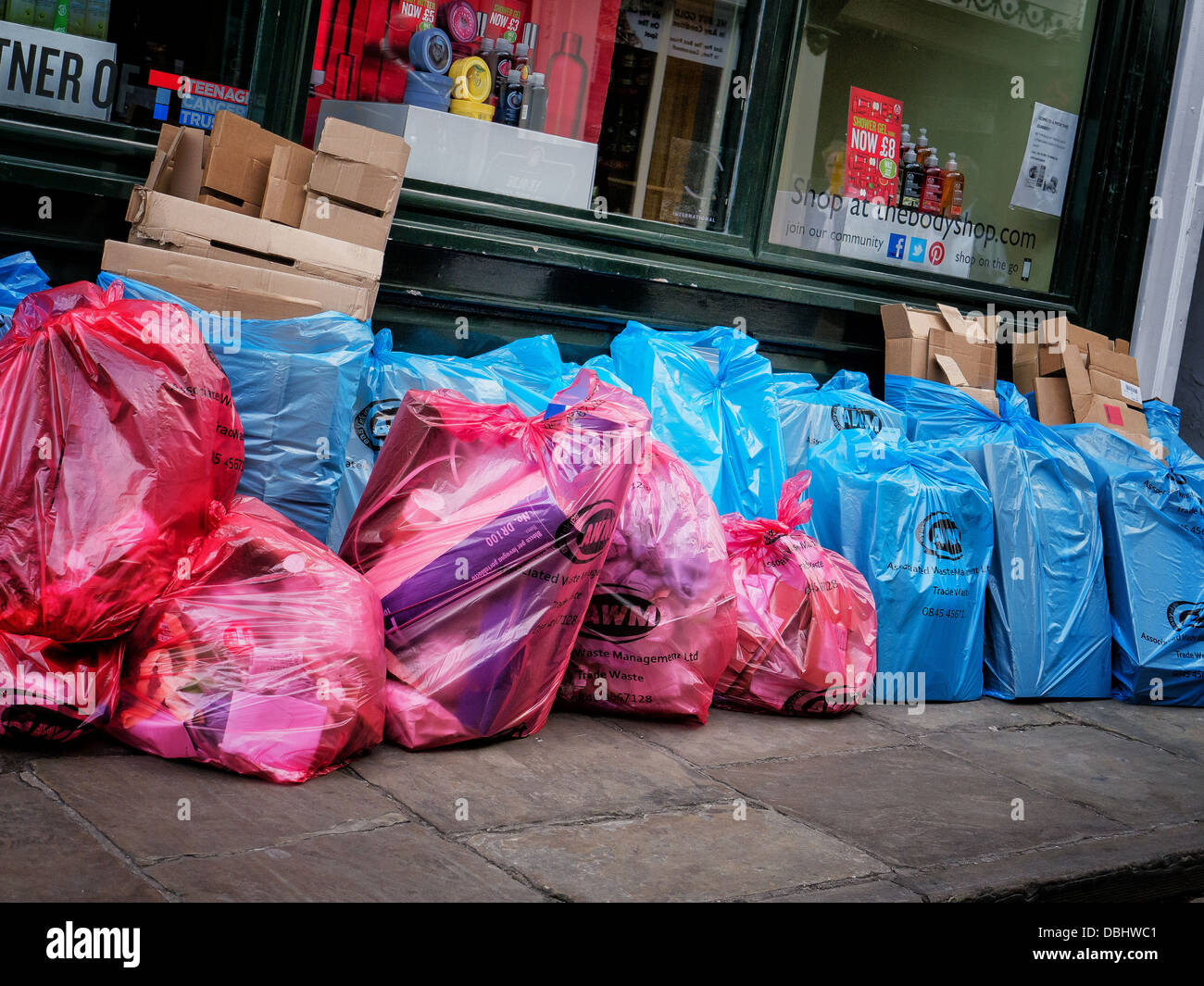 Bagged waste refuse trash and recycling waiting to be collected on a