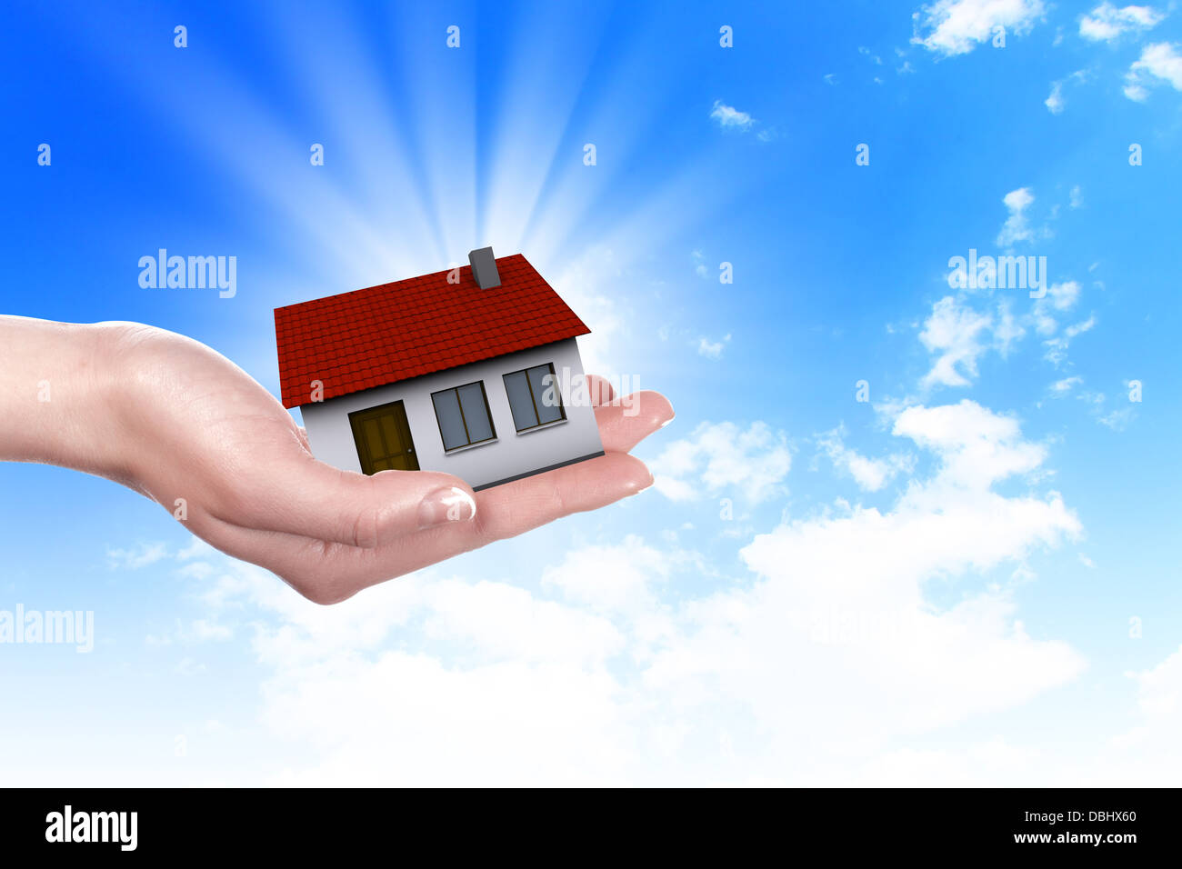 the house in hands on blue sky Stock Photo - Alamy
