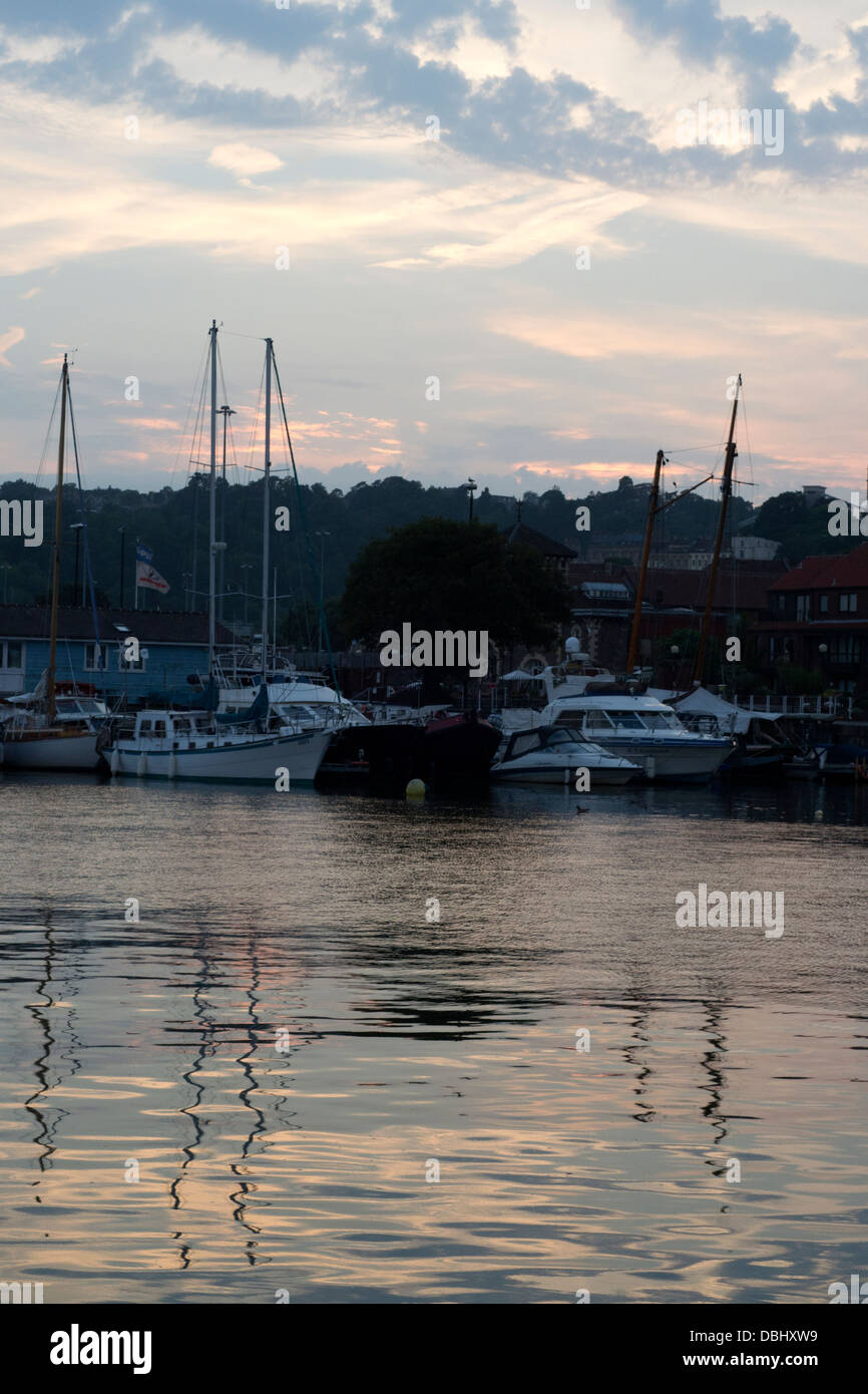 Reflection of boats and clouds in water of harbour hi-res stock ...