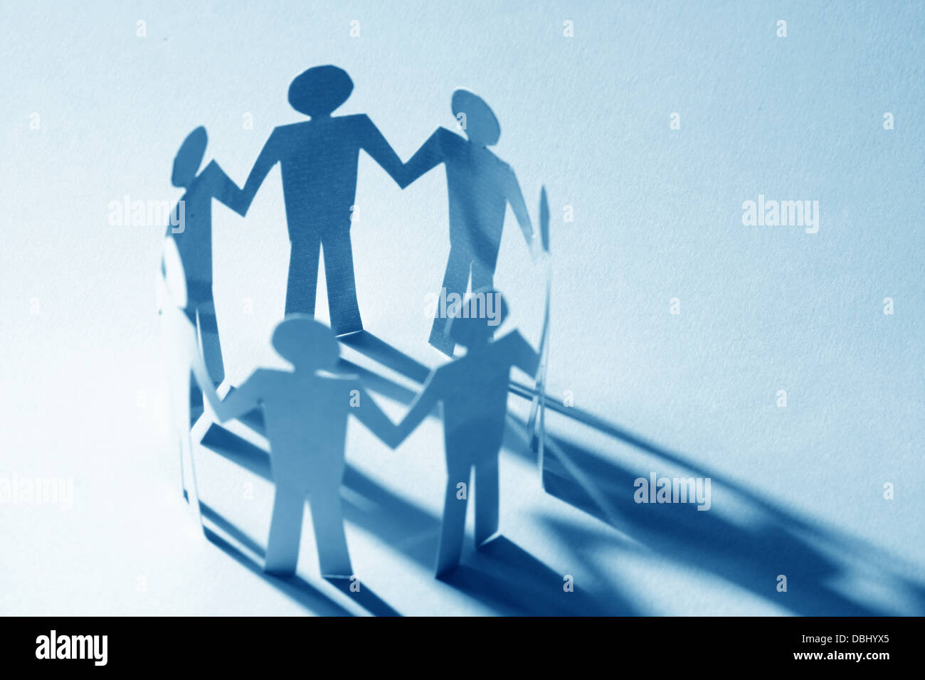 paper team linked together partnership concept Stock Photo